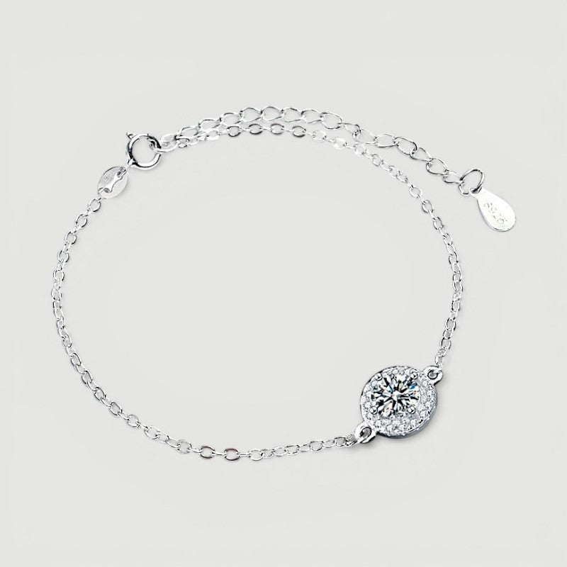Amara Jewels 925 sterling silver bracelet with round halo zircon charm and adjustable chain.