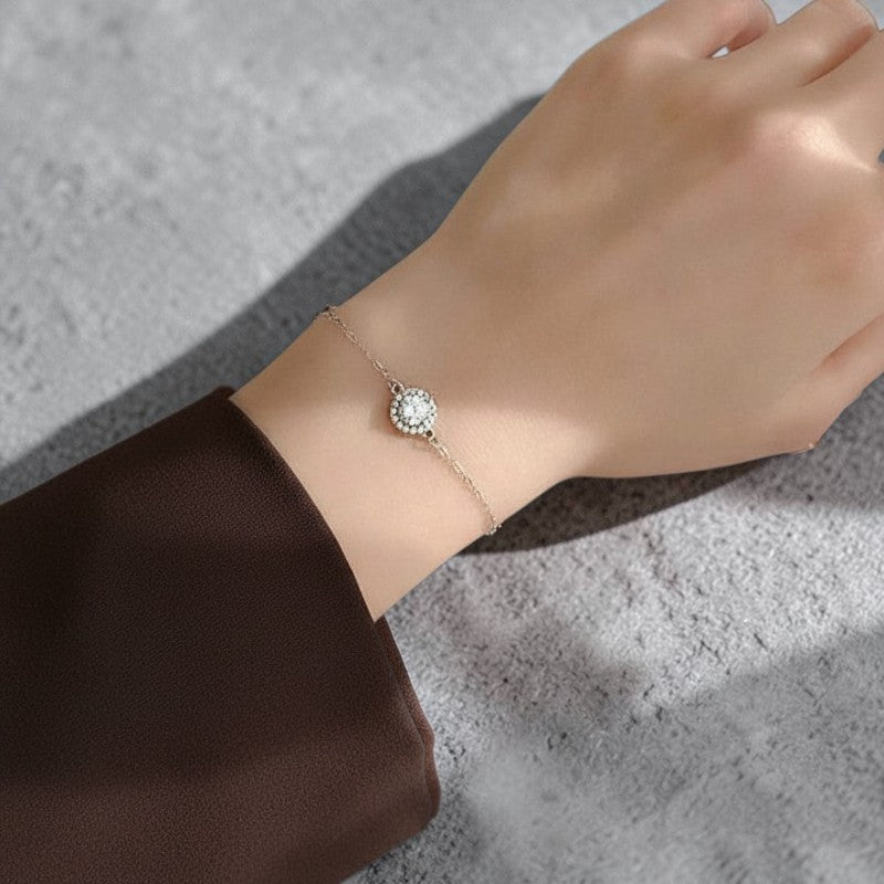 Amara Jewels 925 sterling silver bracelet with round halo zircon charm and adjustable chain.