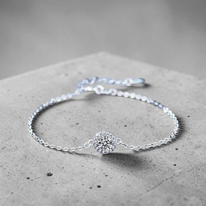 Amara Jewels 925 sterling silver bracelet with round halo zircon charm and adjustable chain.