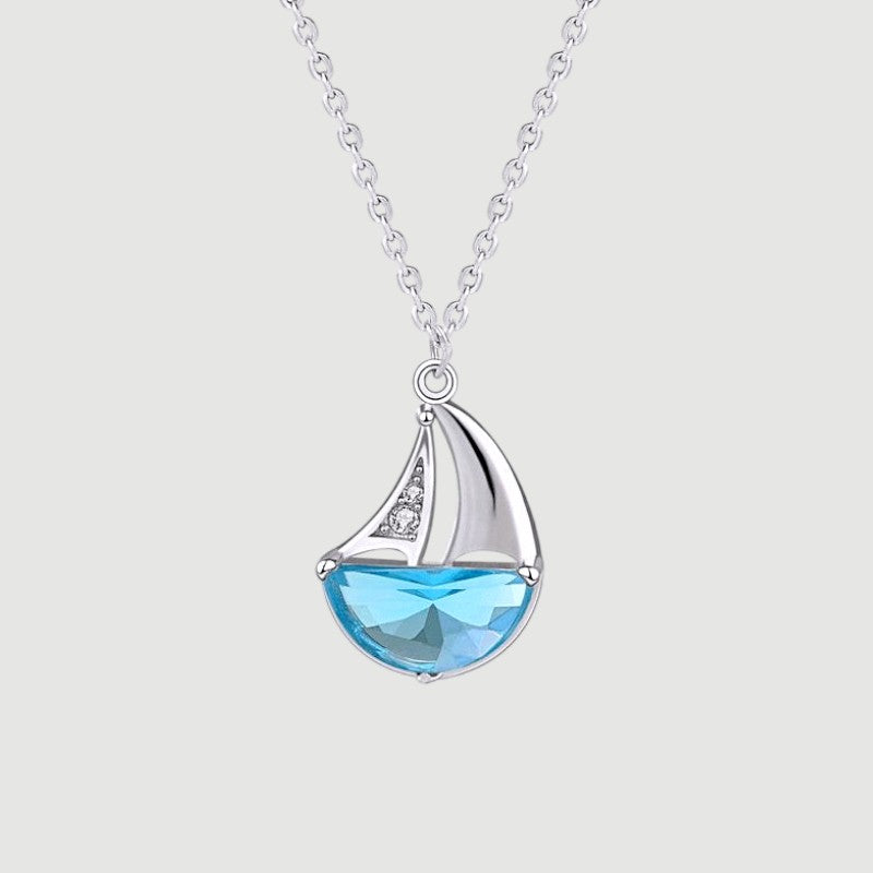 Amara Jewels 925 sterling silver sailboat necklace with blue crystal and cubic zirconia accents.