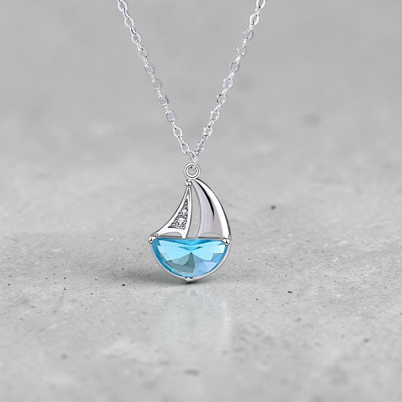 Amara Jewels 925 sterling silver sailboat necklace with blue crystal and cubic zirconia accents.