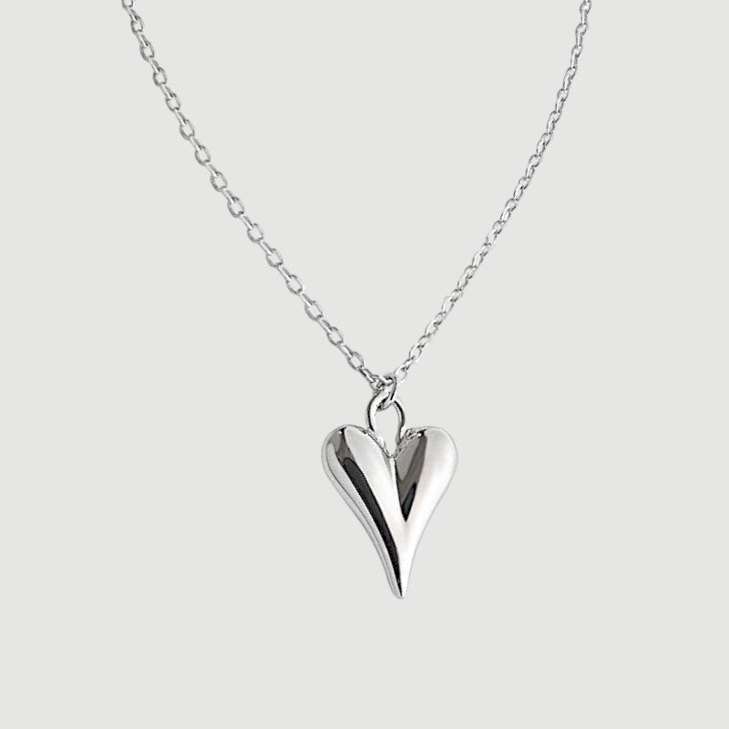 Amara Jewels sculpted heart pendant necklace in polished sterling silver with a delicate chain.