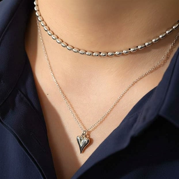 Amara Jewels sculpted heart pendant necklace in polished sterling silver with a delicate chain.