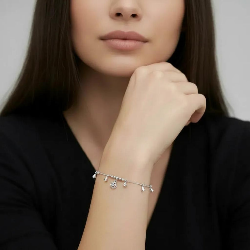 Amara Jewels Sterling Silver bracelet with bell-shaped charms and a hollow oval charm.