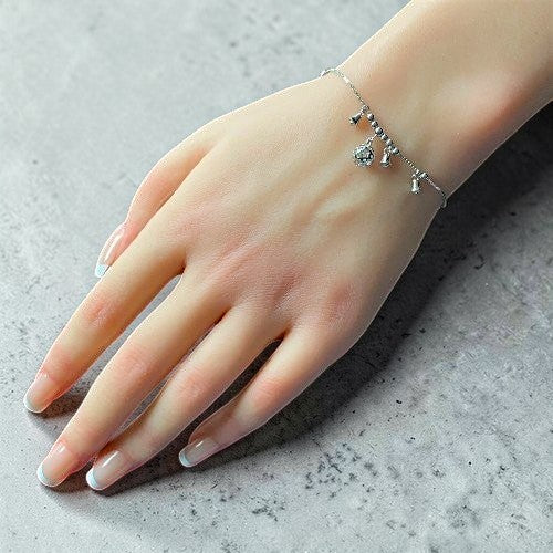 Amara Jewels Sterling Silver bracelet with bell-shaped charms and a hollow oval charm.