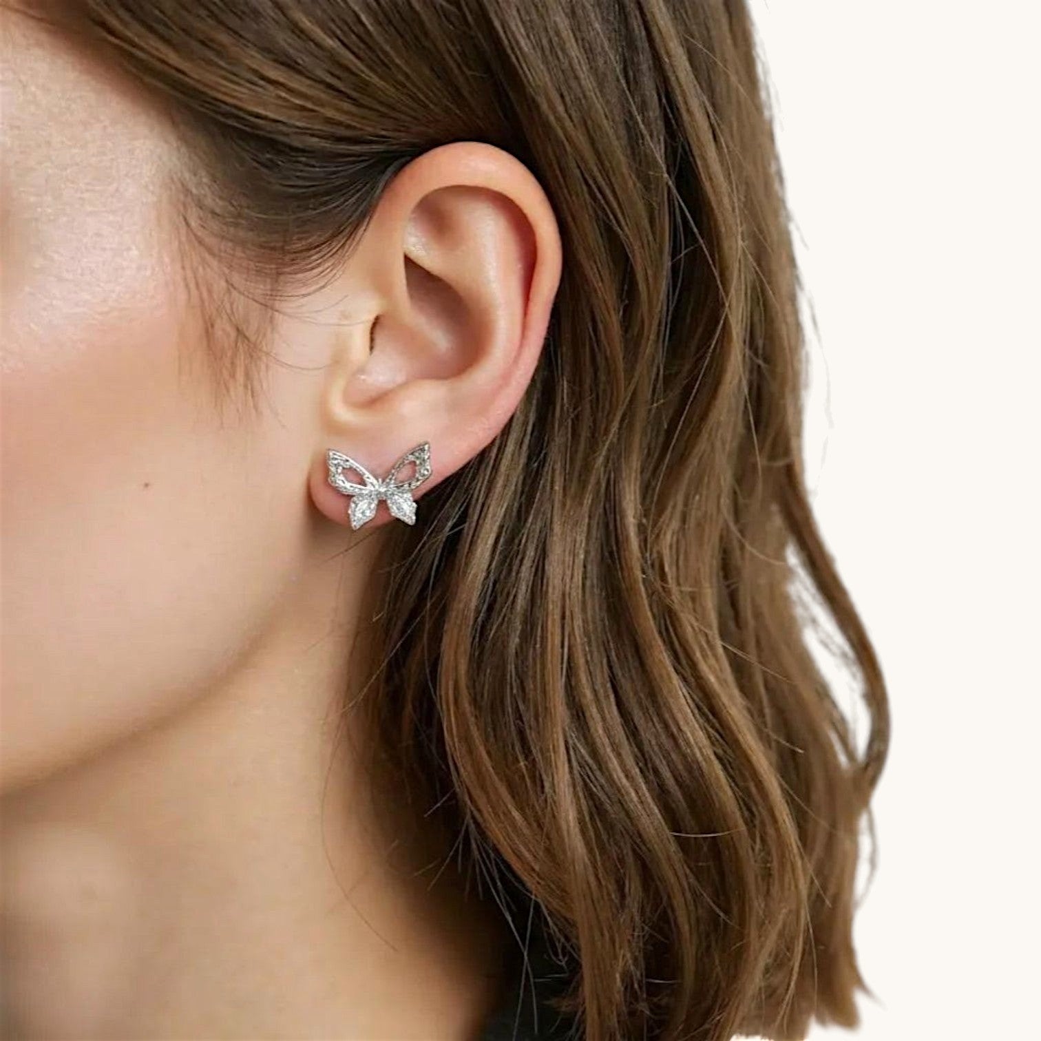 Amara Jewels 925 sterling silver butterfly stud earrings with openwork wings and clear cubic zirconia.