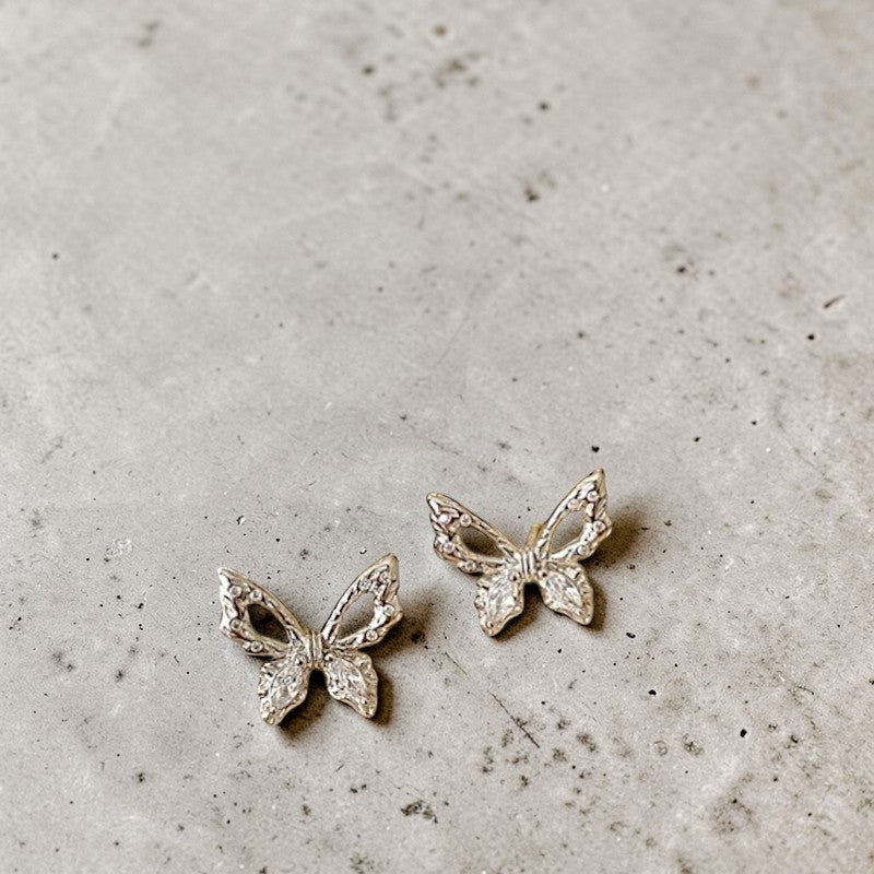 Amara Jewels 925 sterling silver butterfly stud earrings with openwork wings and clear cubic zirconia.