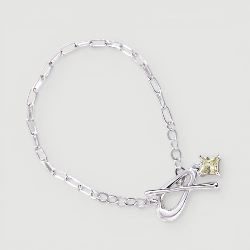 Amara Jewels sterling silver bracelet with paperclip chain, T-bar clasp, and a square citrine-colored charm.