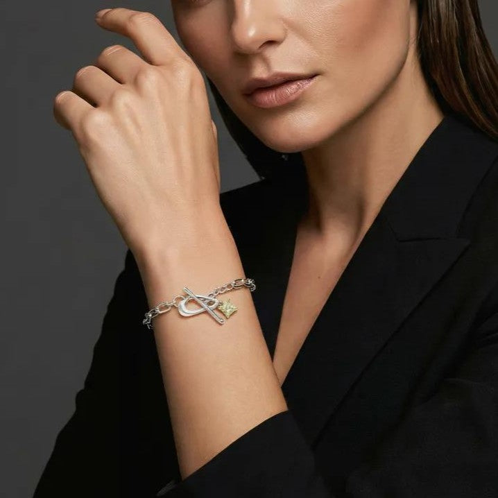 Amara Jewels sterling silver bracelet with paperclip chain, T-bar clasp, and a square citrine-colored charm.