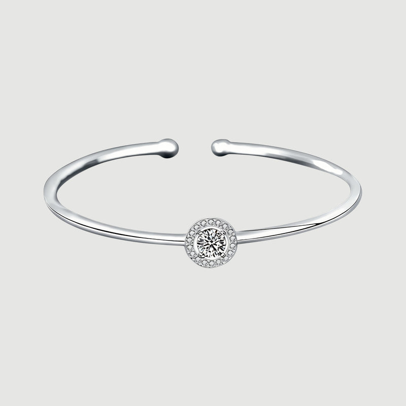 Amara Jewels 925 sterling silver bangle with a sparkling crystal centerpiece, perfect for adding elegance to any outfit.