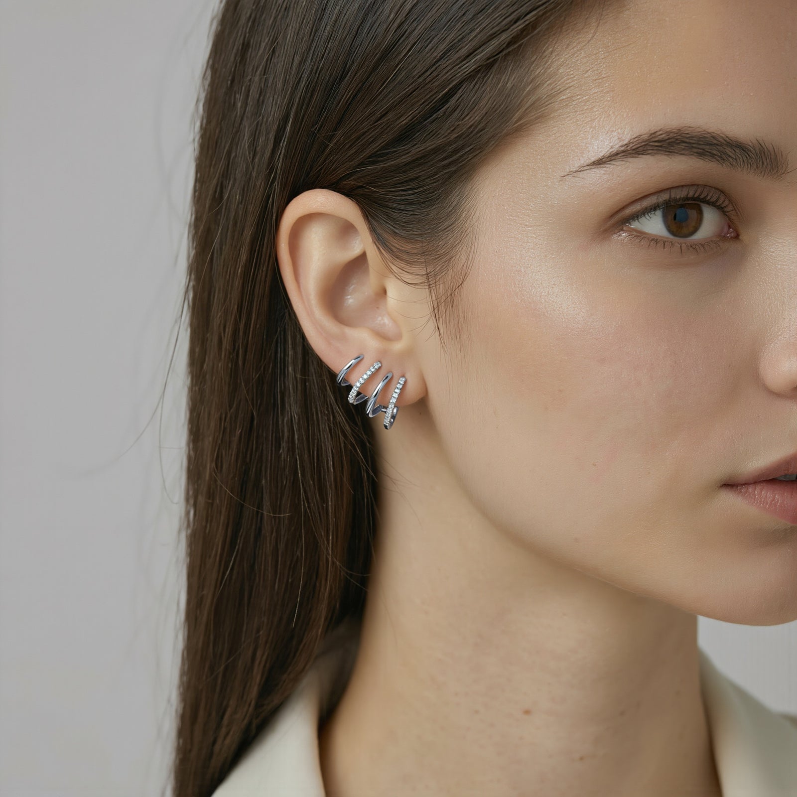 Amara Jewels silver 925 sterling ear cuff stud earrings with cubic zirconia accents and wrap-around design.