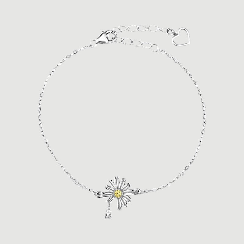 Amara Jewels 925 sterling silver daisy bracelet with yellow and white zircon stones, delicate chain and heart clasp.