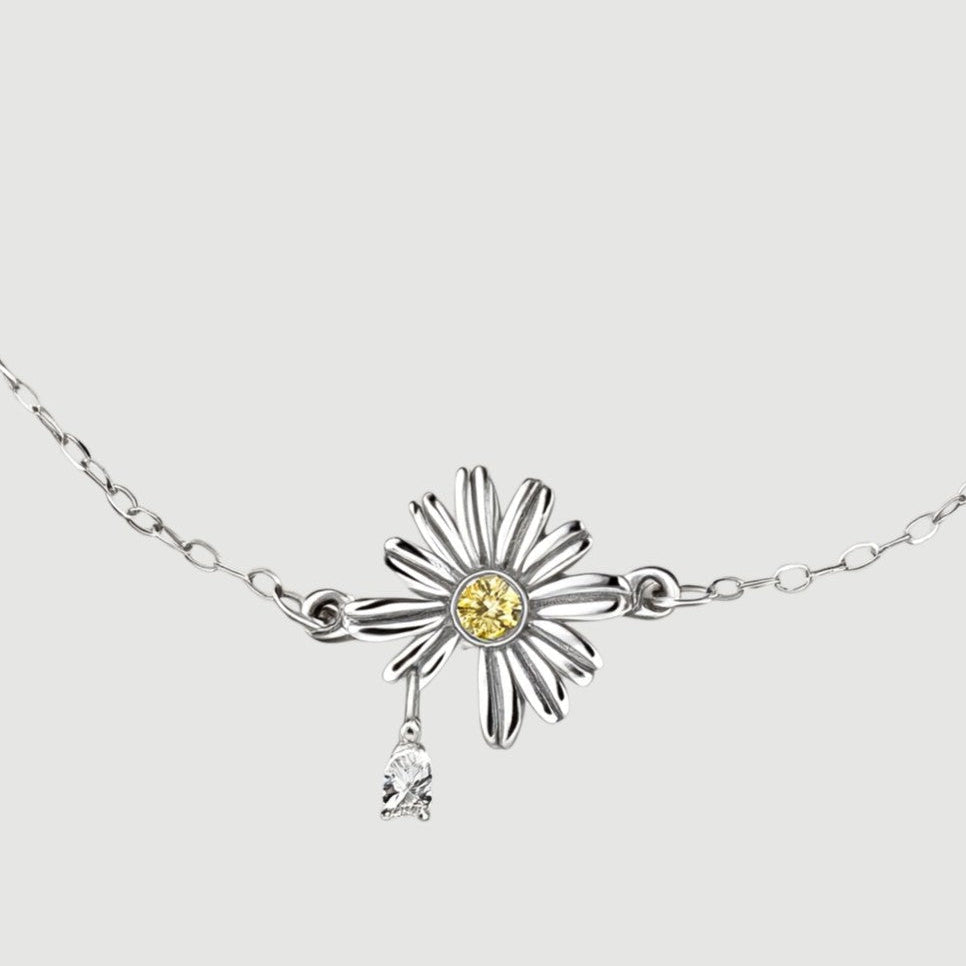 Amara Jewels 925 sterling silver daisy bracelet with yellow and white zircon stones, delicate chain and heart clasp.
