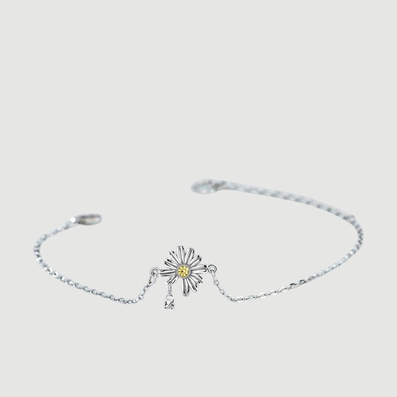 Amara Jewels 925 sterling silver daisy bracelet with yellow and white zircon stones, delicate chain and heart clasp.