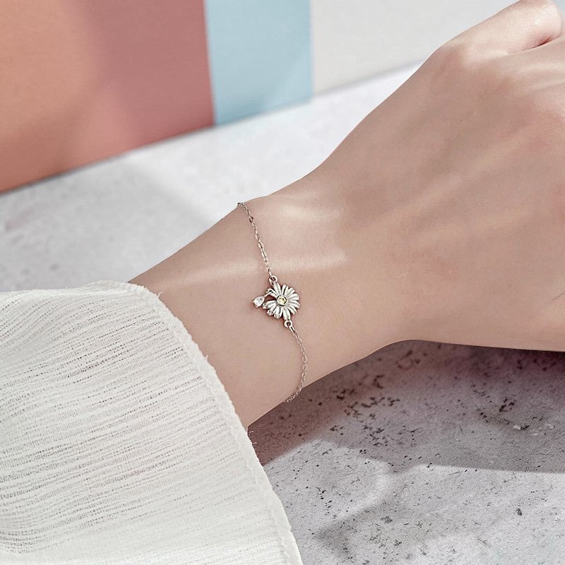 Amara Jewels 925 sterling silver daisy bracelet with yellow and white zircon stones, delicate chain and heart clasp.
