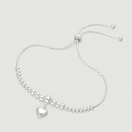 Amara Jewels sterling silver beaded bracelet with a dangling heart charm and adjustable sliding closure.