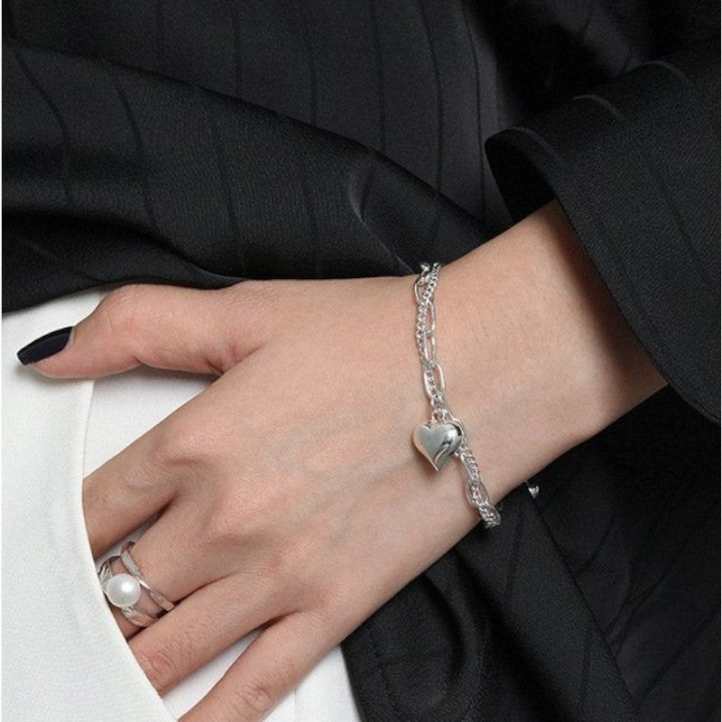 Amara Jewels 925 sterling silver dual-chain bracelet with adjustable length and a polished heart charm.