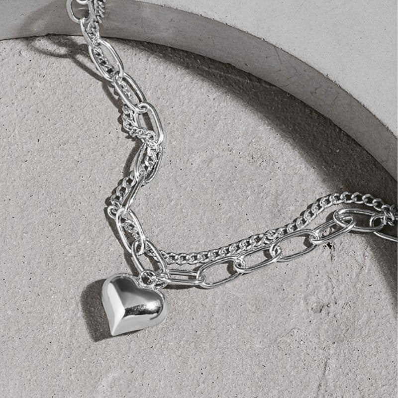 Amara Jewels 925 sterling silver dual-chain bracelet with adjustable length and a polished heart charm.