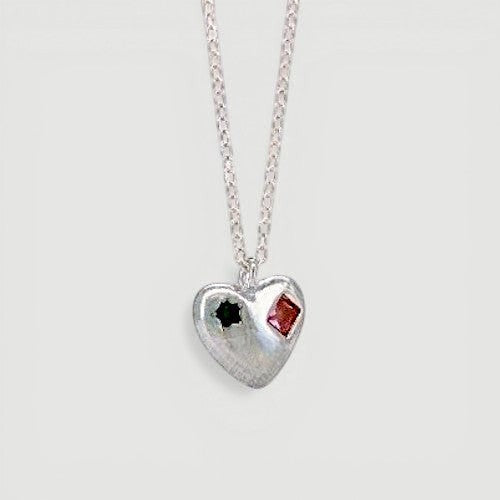 Amara Jewels sterling silver heart charm necklace with engraved red and green shapes.