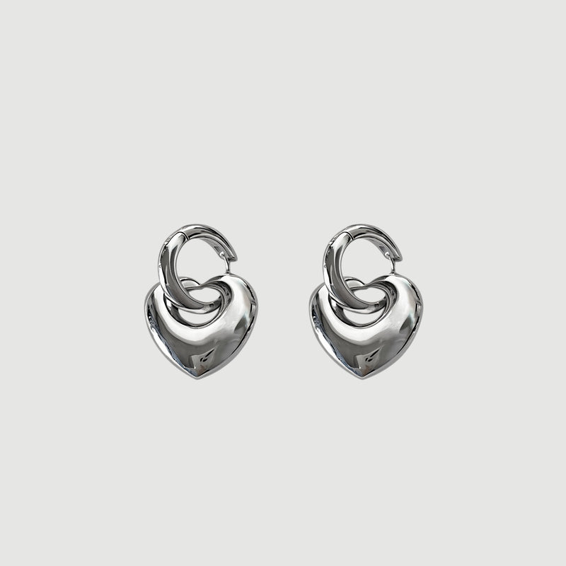 Amara Jewels Sterling Silver Bold Interlocking Heart Hoop Earrings. Polished silver, modern design.