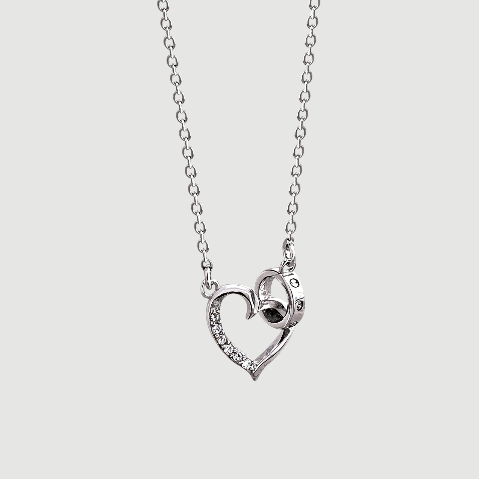 Amara Jewels silver 925 sterling necklace with a delicate heart pendant featuring crystal accents and an intertwined ring detail.