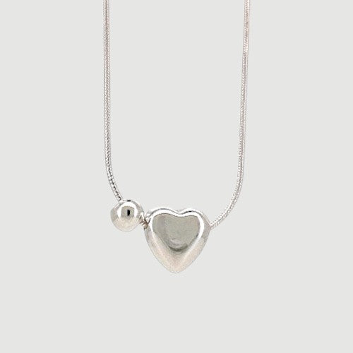 Amara Jewels sterling silver necklace with a heart charm and a small sphere.