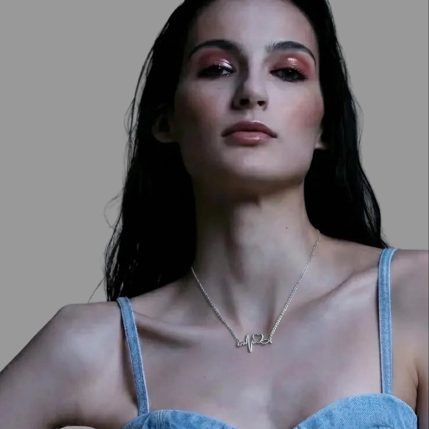 Amara Jewels silver heartbeat necklace with a heart symbol, made of sterling silver.