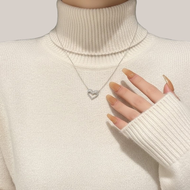 Amara Jewels silver hollow heart necklace with crystal embellishments, delicate chain.