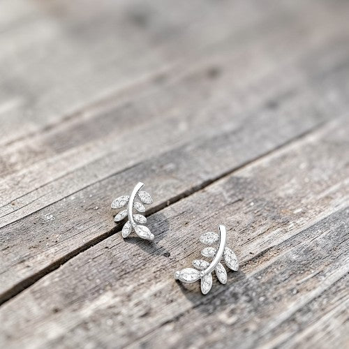Amara Jewels rhodium-plated sterling silver leaf stud earrings with clear cubic zirconia.