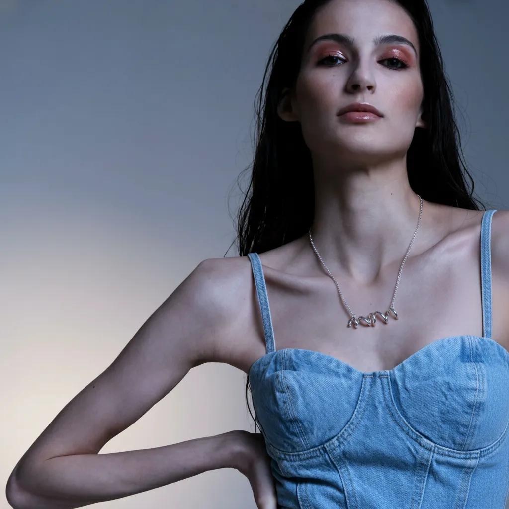 Amara Jewels sterling silver spiral twist necklace with polished finish and contemporary coiled design.