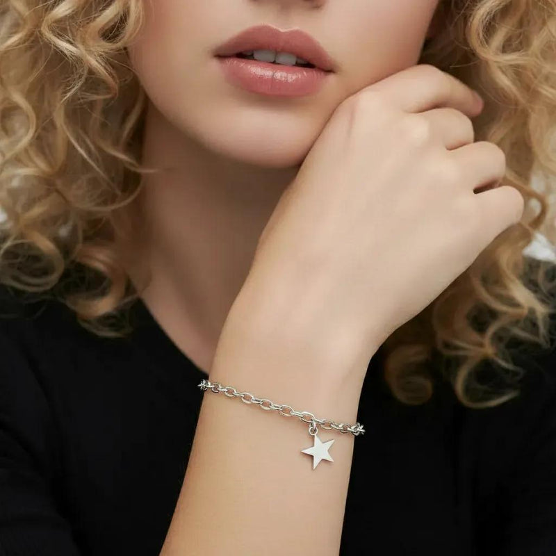 Amara Jewels sterling silver chain bracelet with a dangling star charm and adjustable clasp.