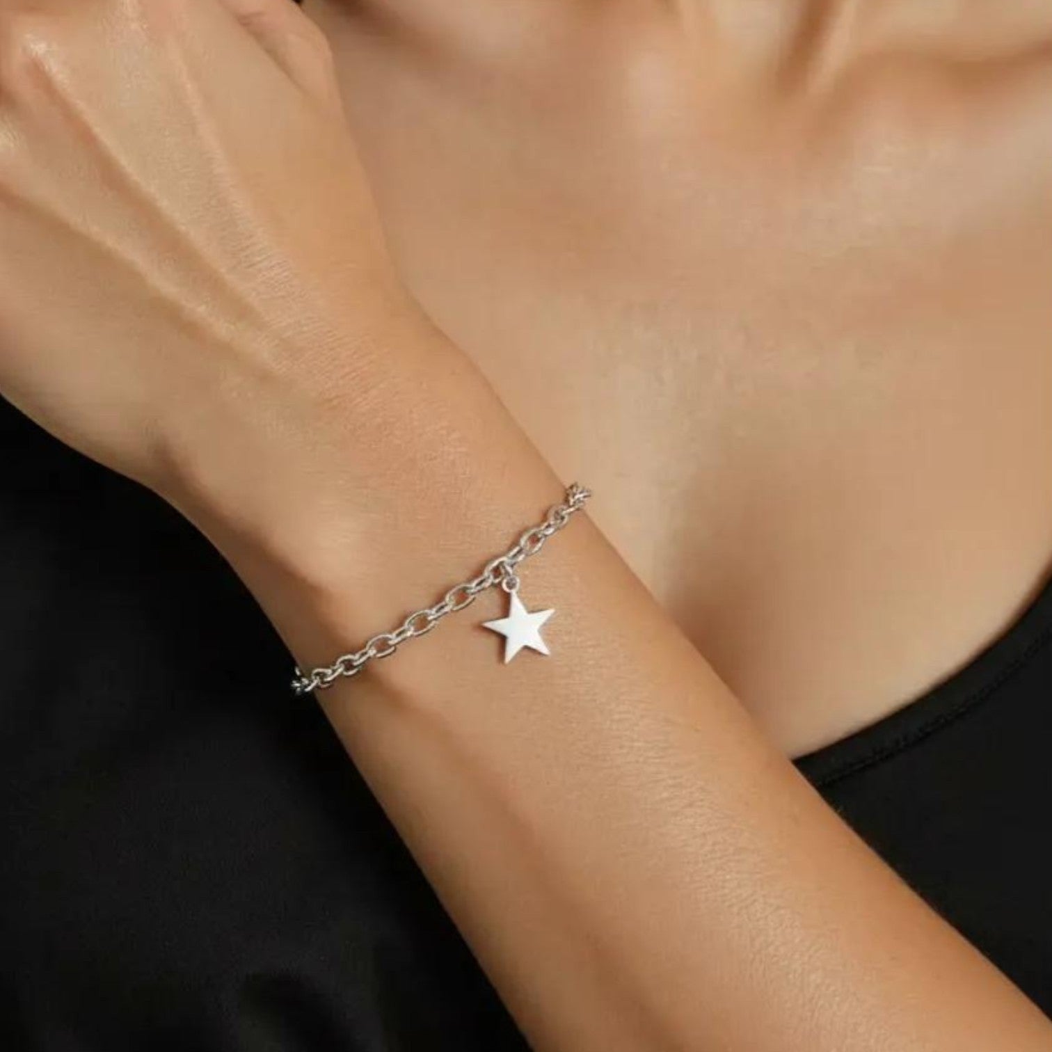 Amara Jewels sterling silver chain bracelet with a dangling star charm and adjustable clasp.