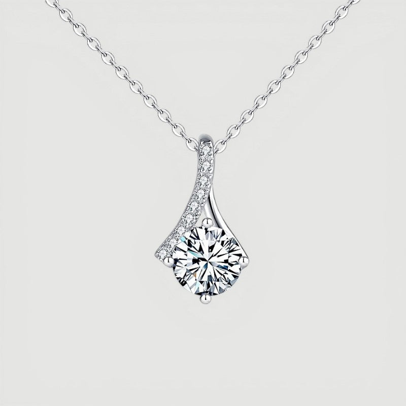Amara Jewels sterling silver teardrop pendant necklace with round-cut crystal and pave detail.