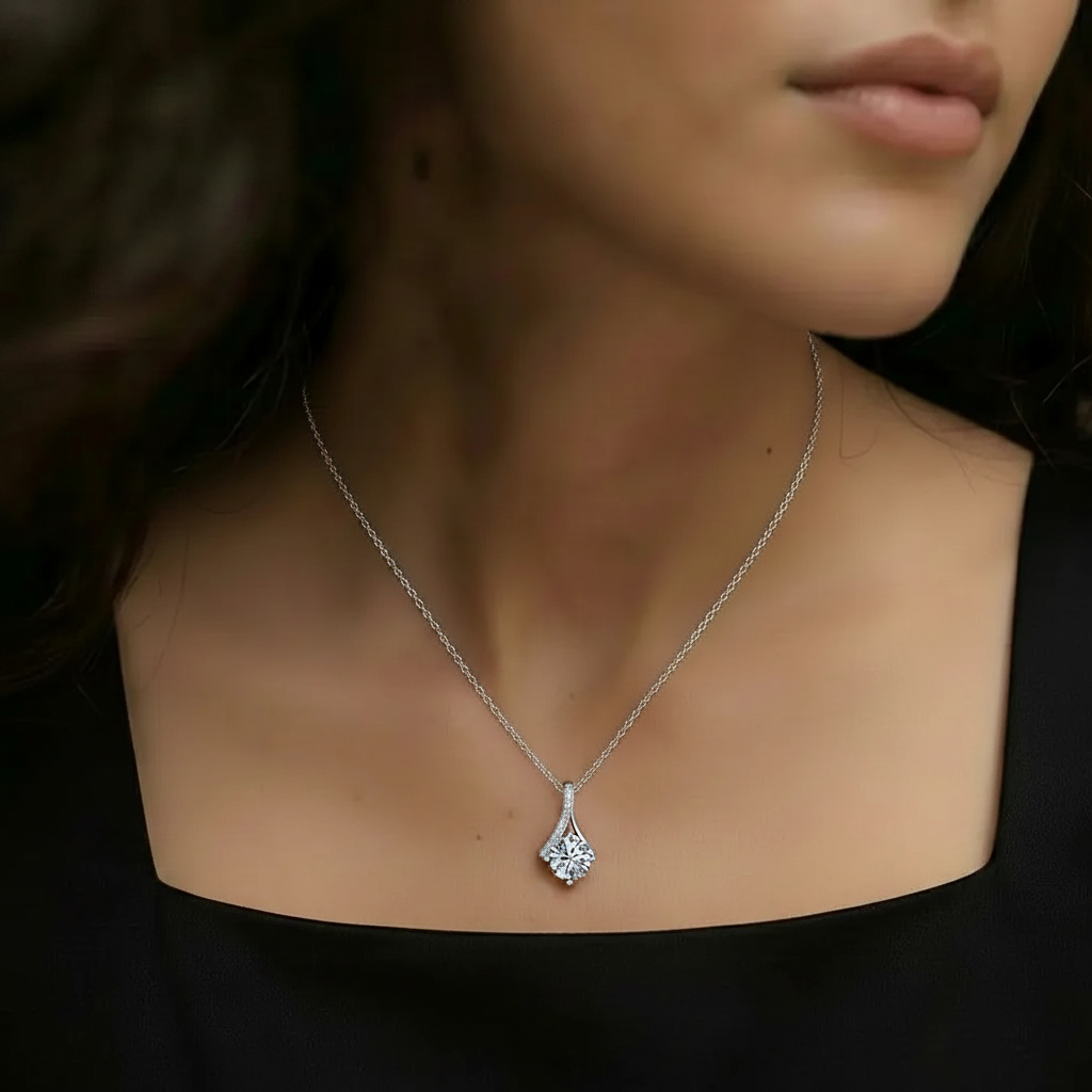 Amara Jewels sterling silver teardrop pendant necklace with round-cut crystal and pave detail.