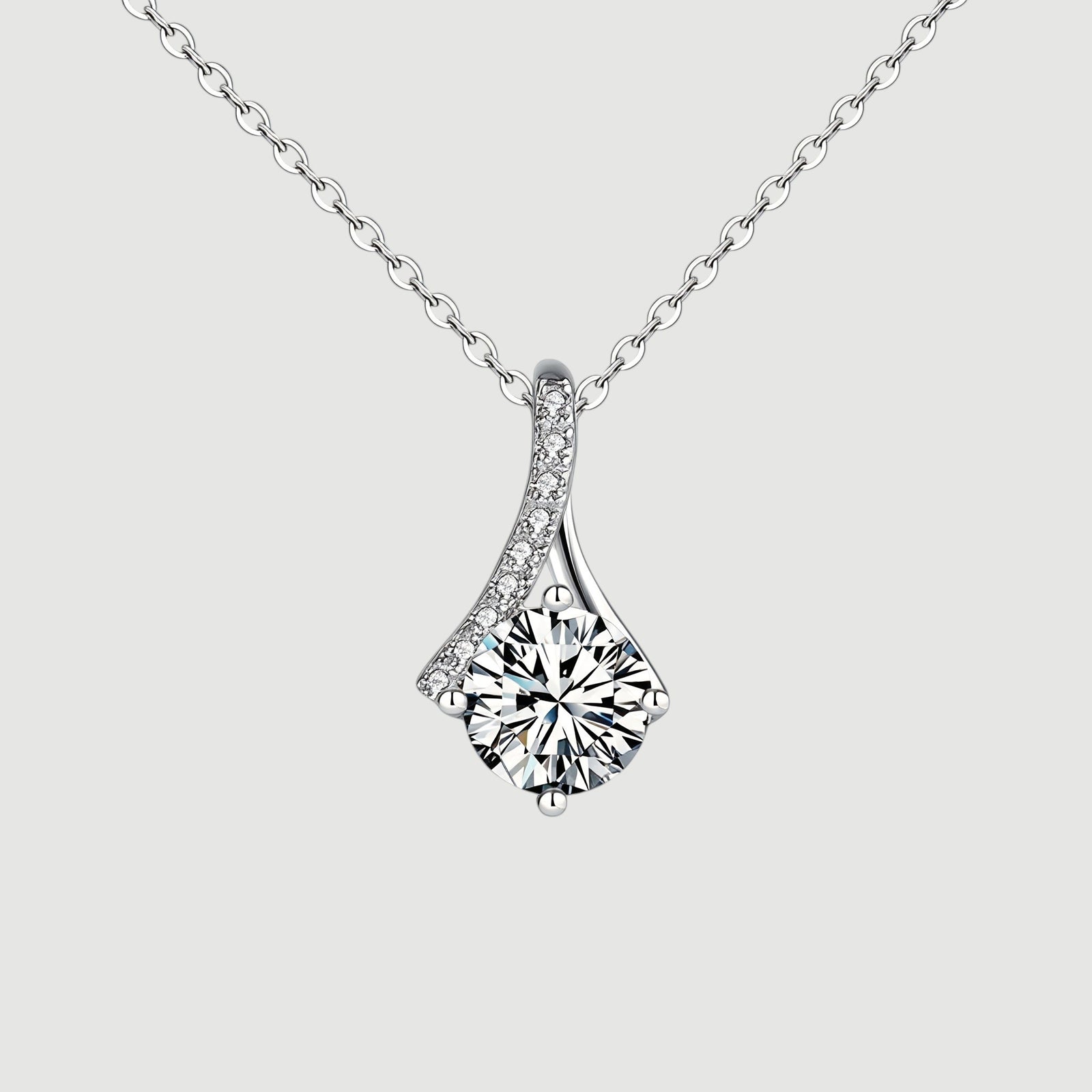 Amara Jewels sterling silver teardrop pendant necklace with round-cut crystal and pave detail.