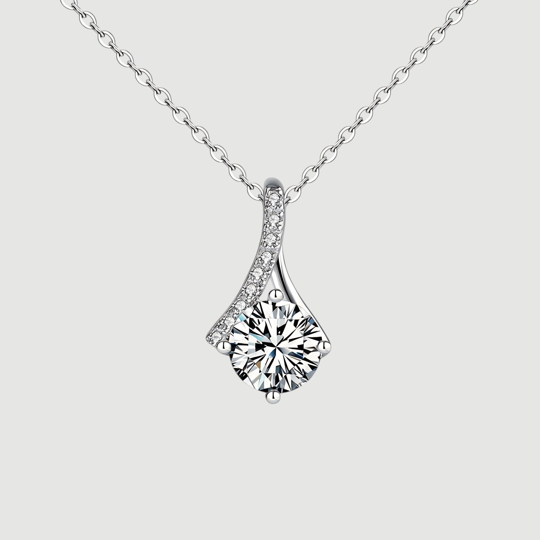 Amara Jewels sterling silver teardrop pendant necklace with round-cut crystal and pave detail.