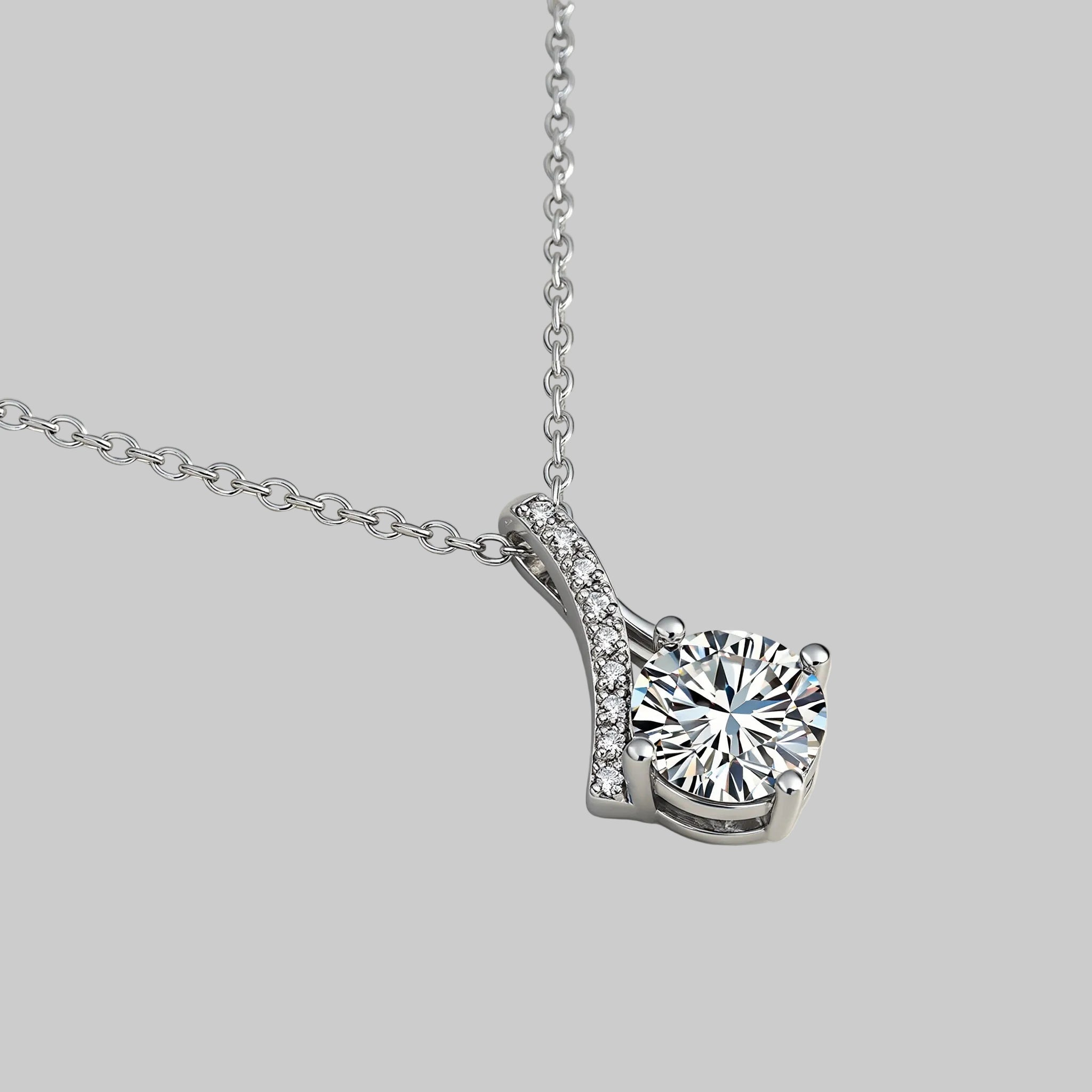 Amara Jewels sterling silver teardrop pendant necklace with round-cut crystal and pave detail.