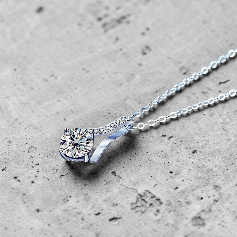 Amara Jewels sterling silver teardrop pendant necklace with round-cut crystal and pave details.