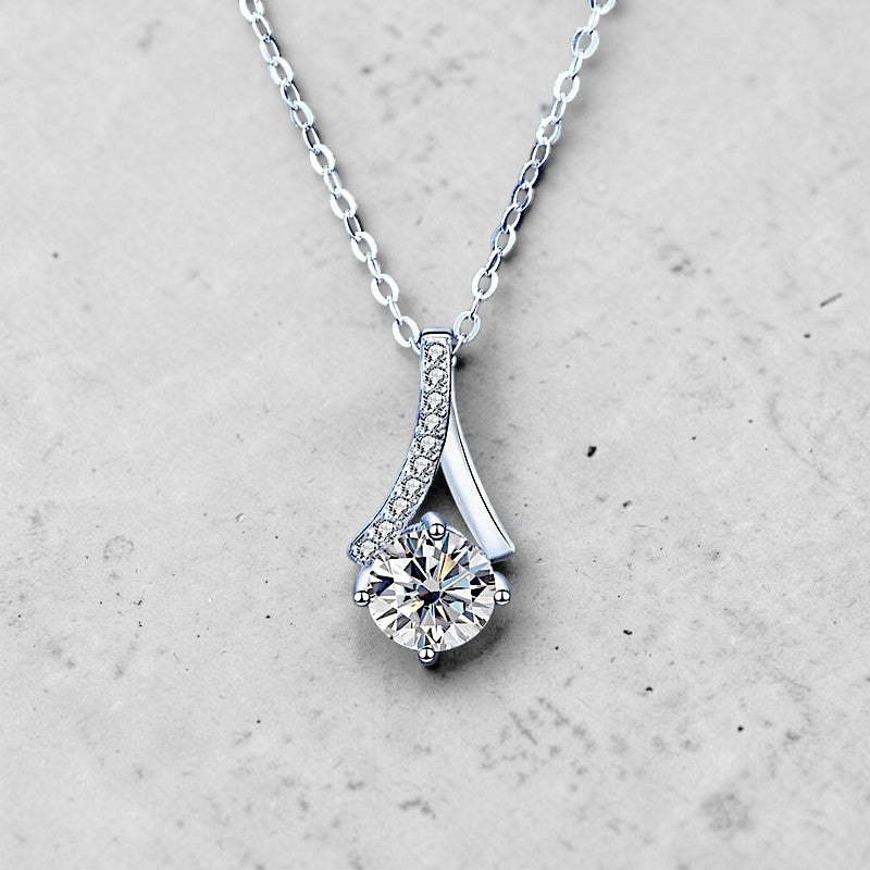 Amara Jewels 925 sterling silver teardrop pendant necklace with round-cut crystal and pave detail.