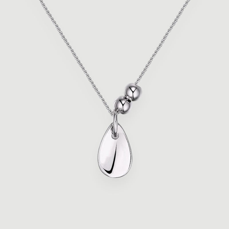 Amara Jewels polished sterling silver teardrop pendant necklace with two accent beads on a delicate chain.