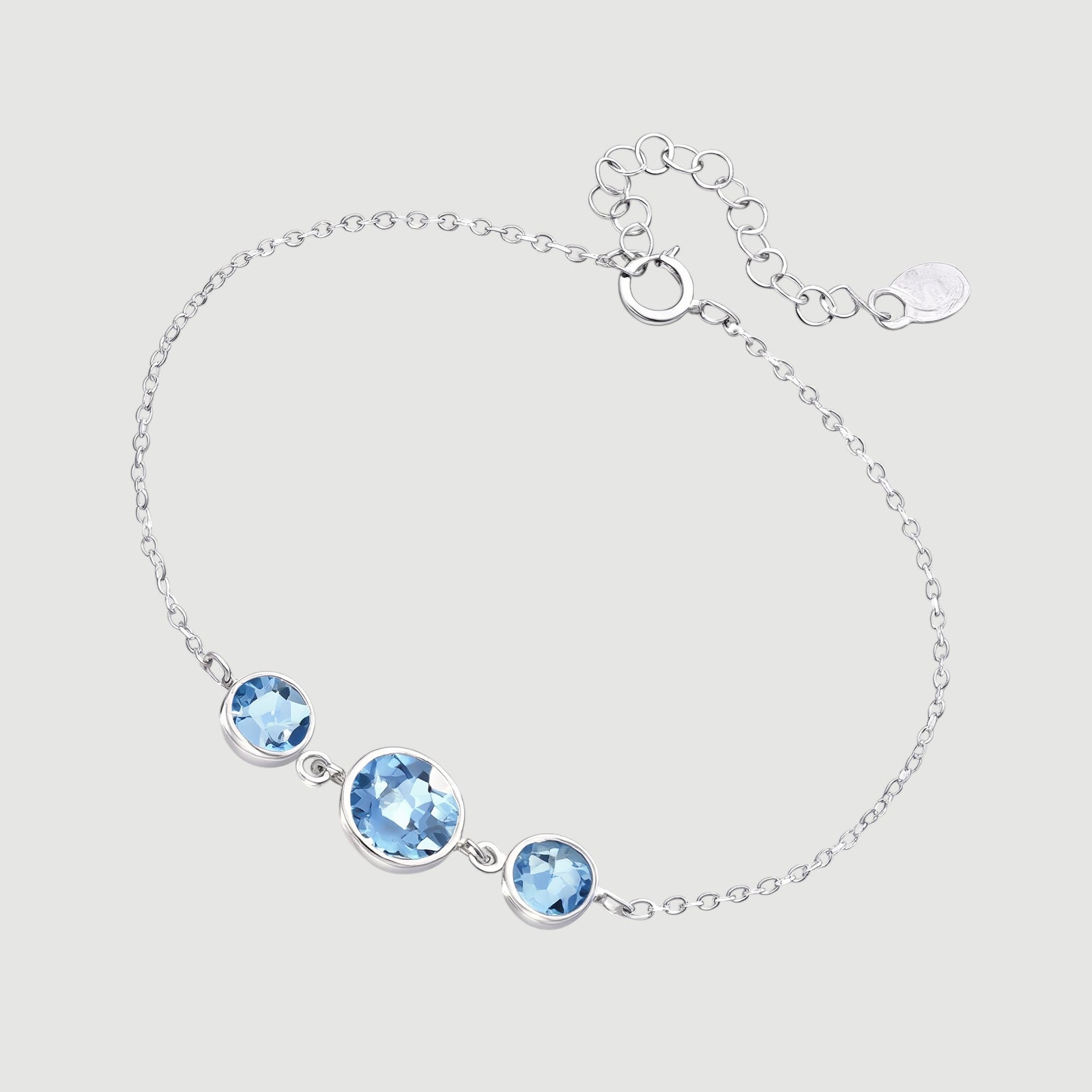 Amara Jewels delicate 925 sterling silver bracelet with three round sky blue topaz stones and adjustable chain.