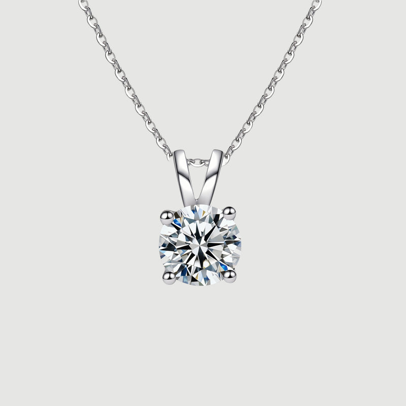 Amara Jewels 925 sterling silver solitaire pendant necklace with four-prong setting and a clear, round-cut gemstone.
