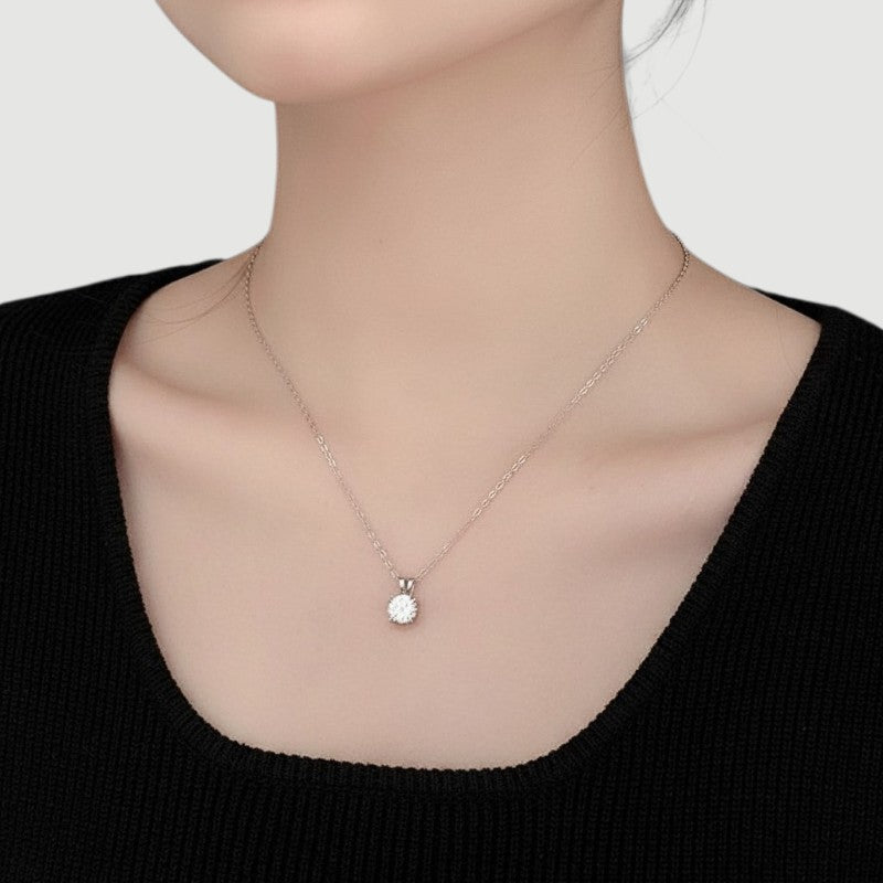 Amara Jewels 925 sterling silver solitaire pendant necklace with four-prong setting and a clear, round-cut gemstone.