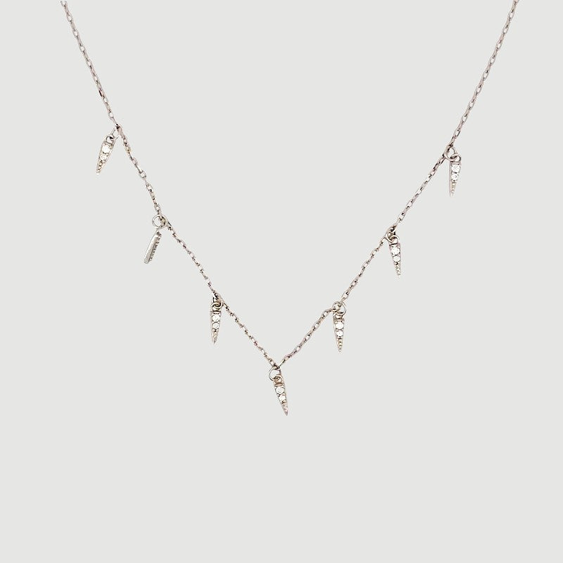 Amara Jewels rhodium-plated sterling silver necklace with dangling spike charms and clear crystals.