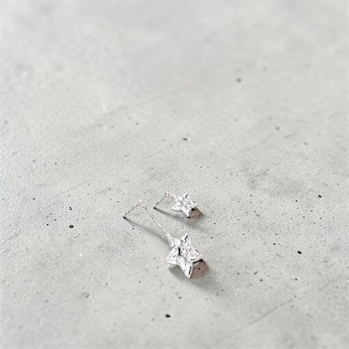 Amara Jewels mismatched star drop earrings in 925 sterling silver with cubic zirconia.