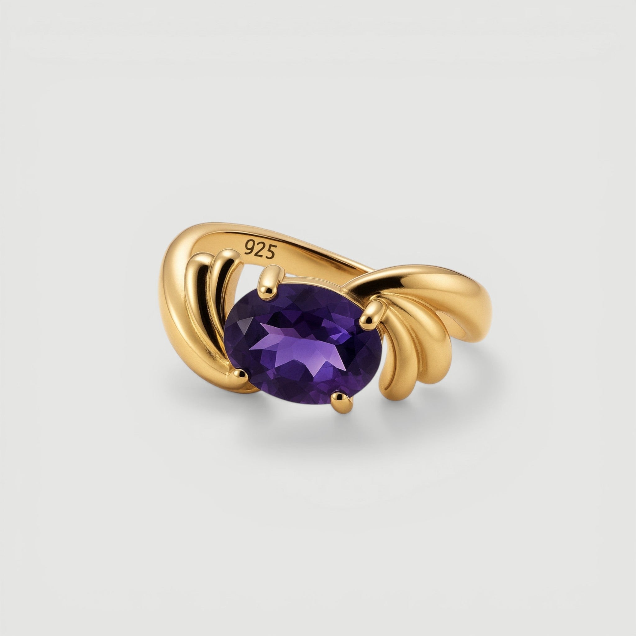 Amara Jewels gold-plated sterling silver ring with oval-cut amethyst and smaller accent stones.
