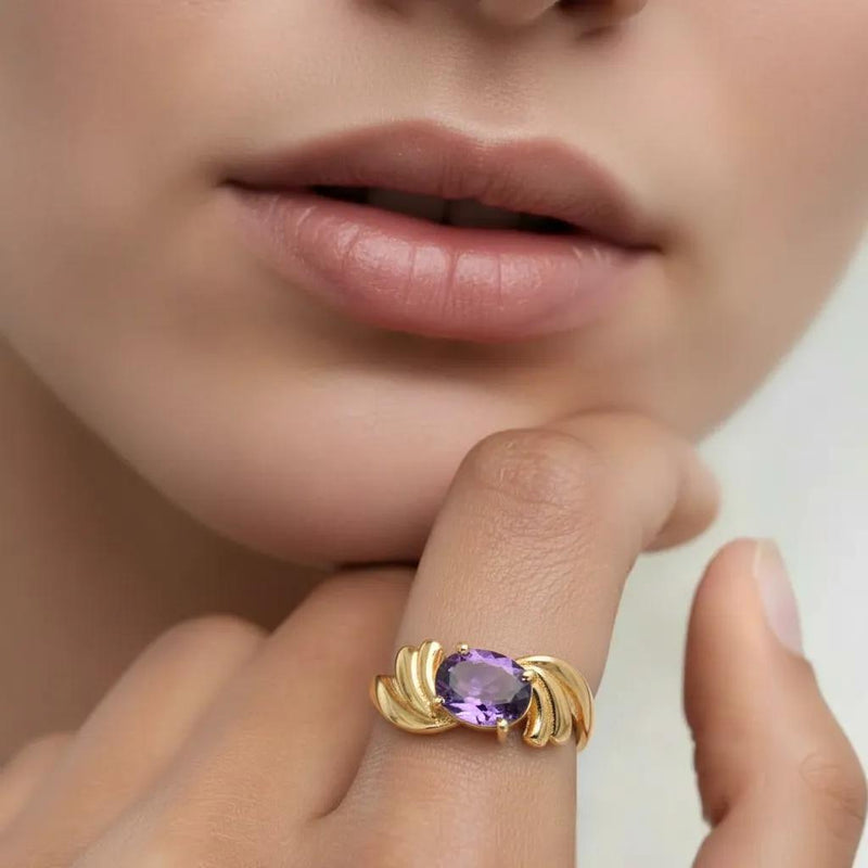 Amara Jewels gold-plated sterling silver ring with oval-cut amethyst and smaller accent stones.