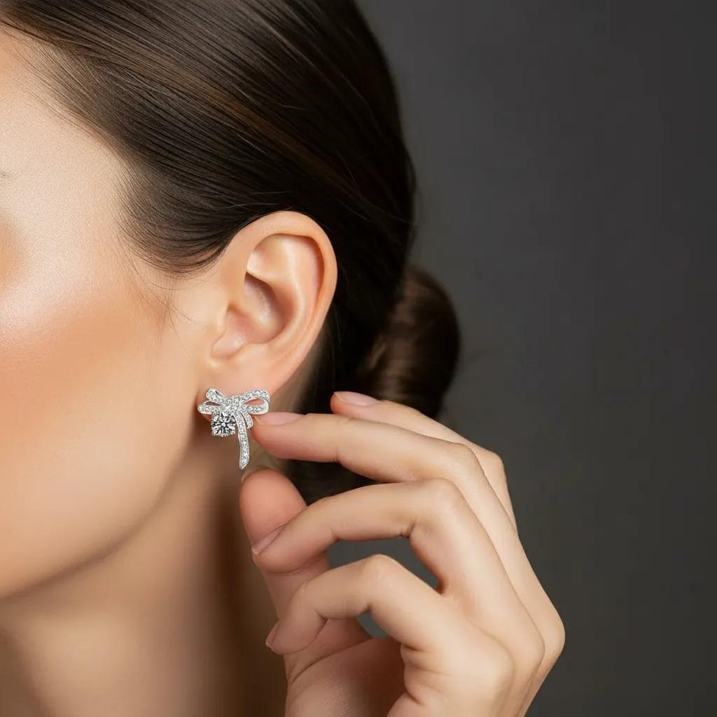 Amara Jewels Sterling Silver Bow Knot Crystal Stud Earrings with shimmering CZ crystals.