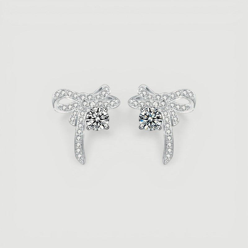 Amara Jewels Sterling Silver Bow Knot Crystal Stud Earrings with shimmering CZ crystals.