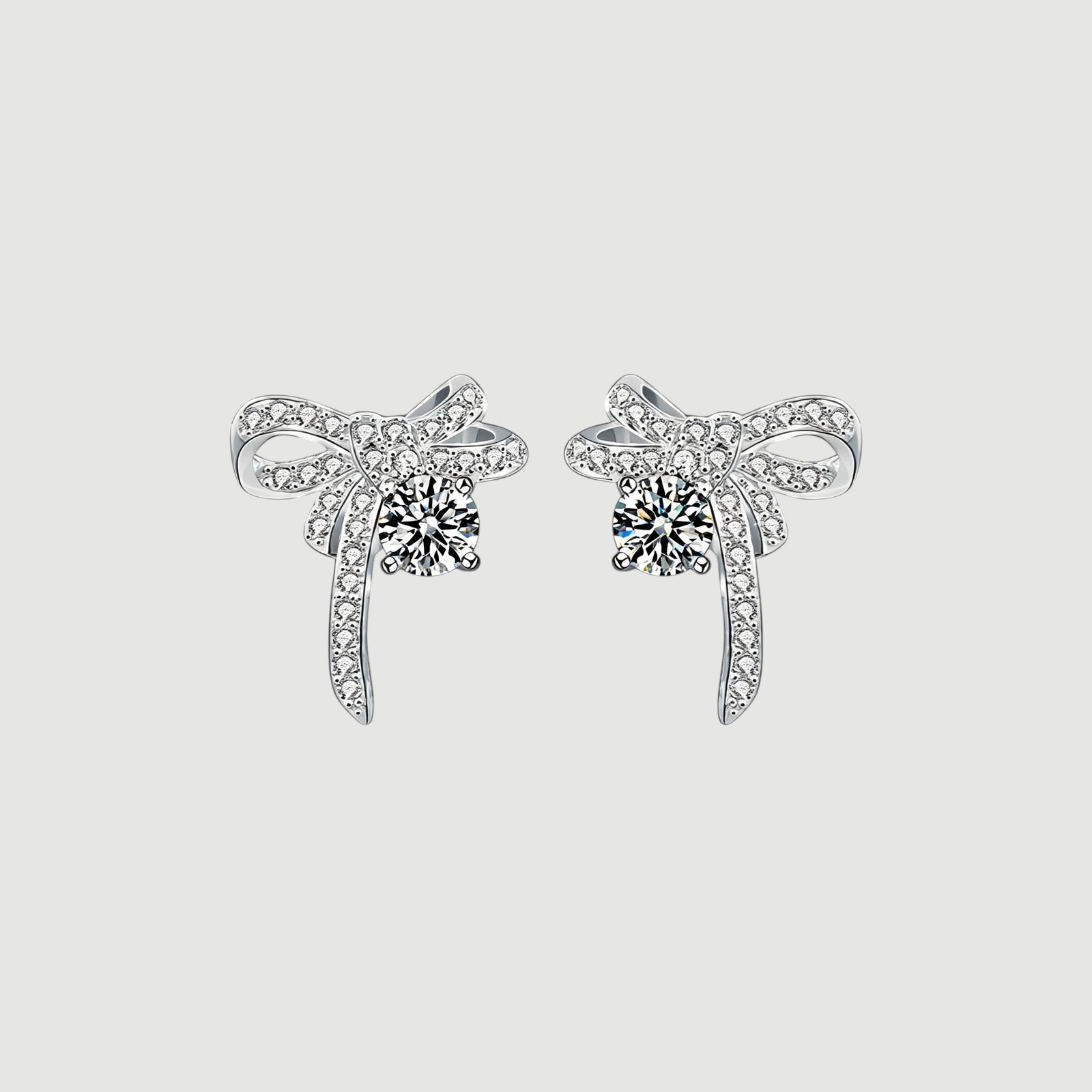 Amara Jewels Sterling Silver Bow Knot Crystal Stud Earrings with shimmering CZ crystals.